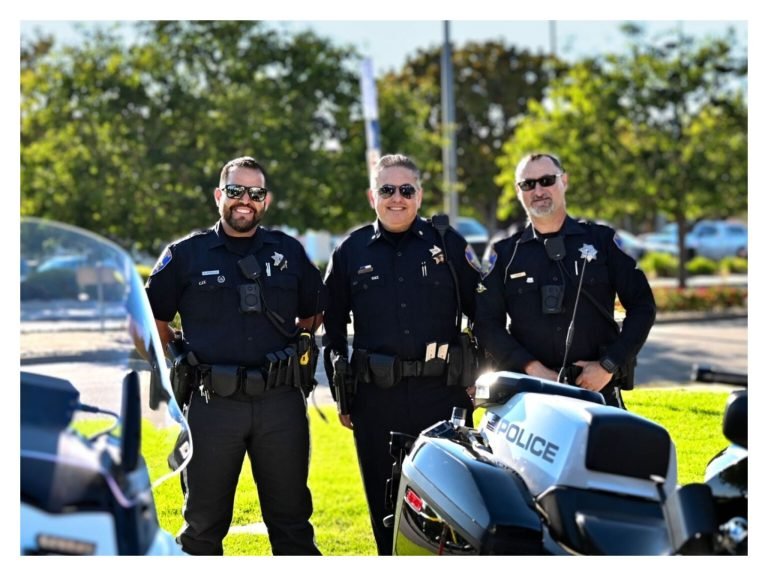 Salinas Police Officers Standing by Motorcycles